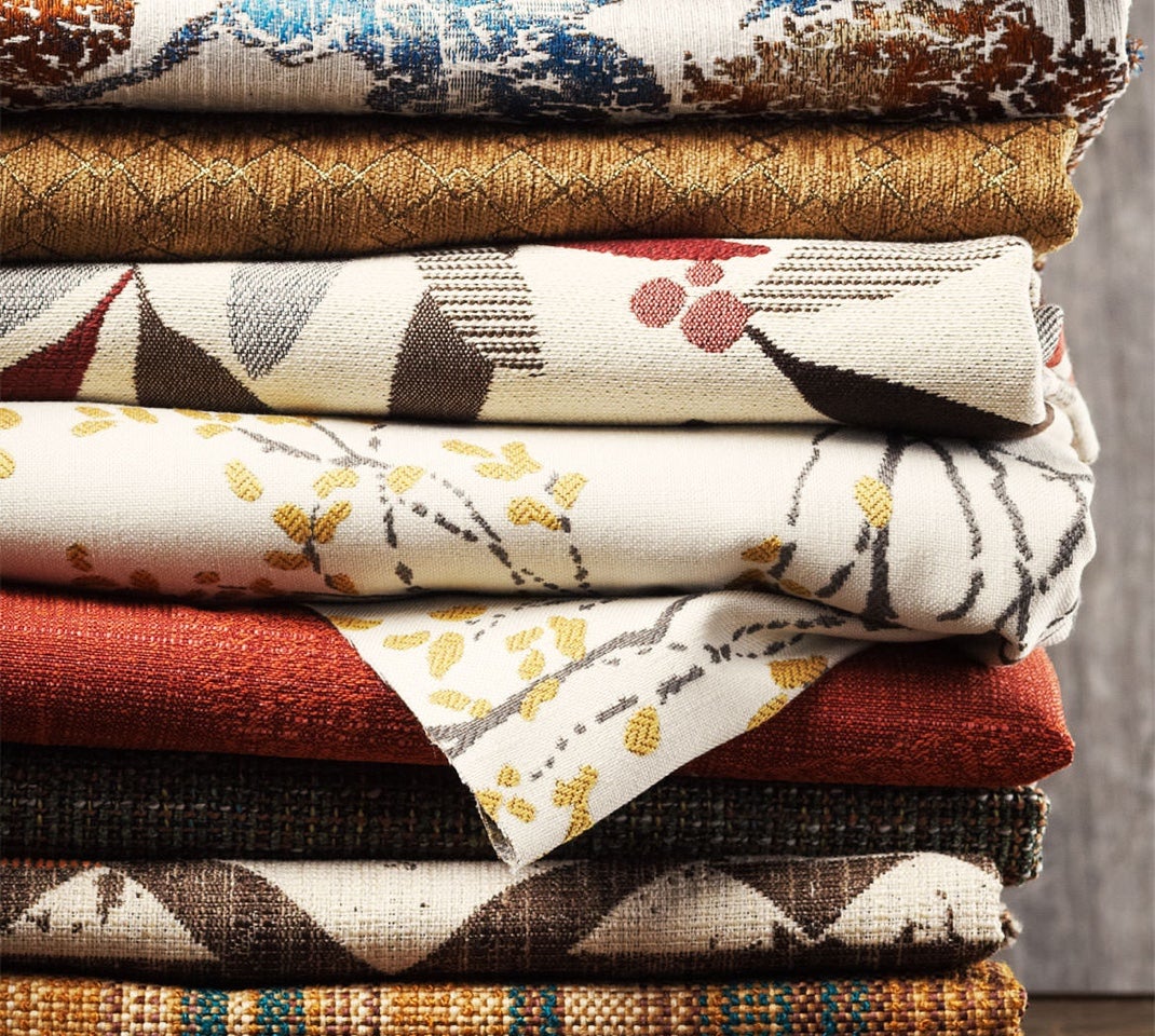 Closeup of stack of covers with various colors, patterns and textures