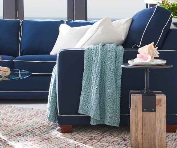 Closeup of Kennedy Sectional with blue cover and contrasting welt