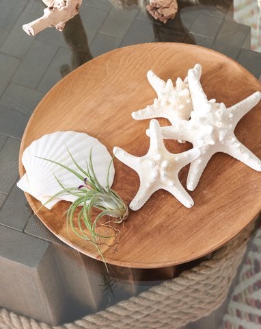 Closeup of accent table with beach-inspired decor