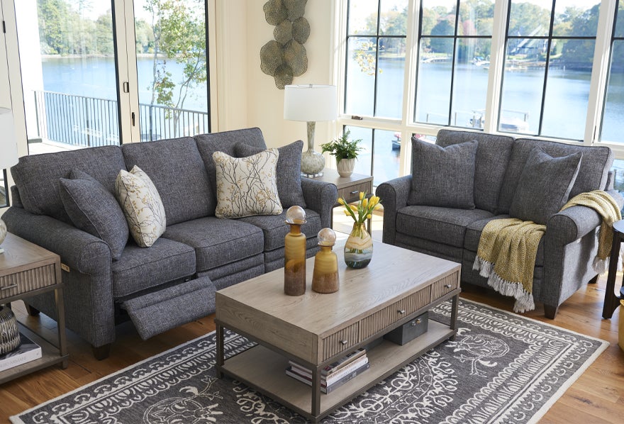 Colby duo® Reclining Sofa and Sanford Round Cocktail Table with accessories