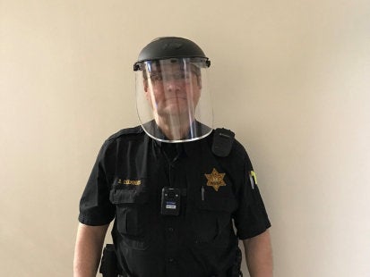 Police officer wearing face shield