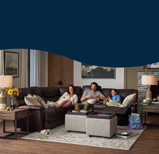 family relaxing on a La-Z-Boy sectional