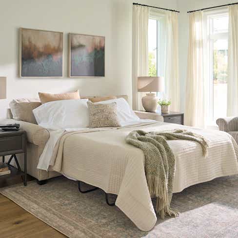 white sofa with a sofa bed pulled out
