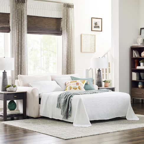 white sofa with a sofa bed pulled out
