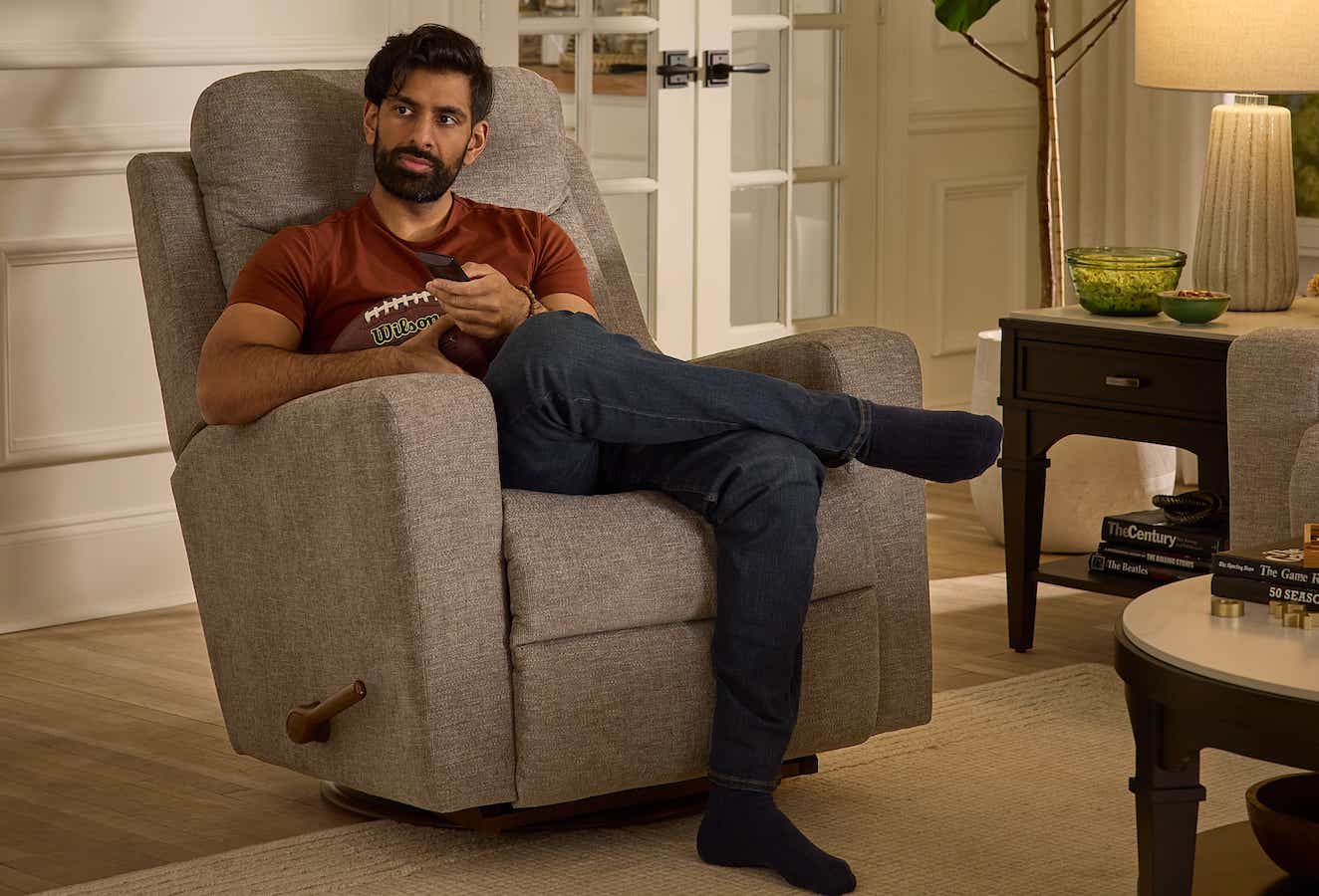 a man watching sports in an Emmons Recliner