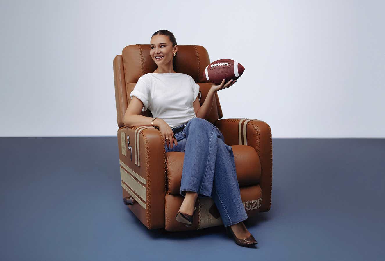 Kristin Juszczyk sitting in a custom La-Z-Boy Jer-Z-Boy recliner