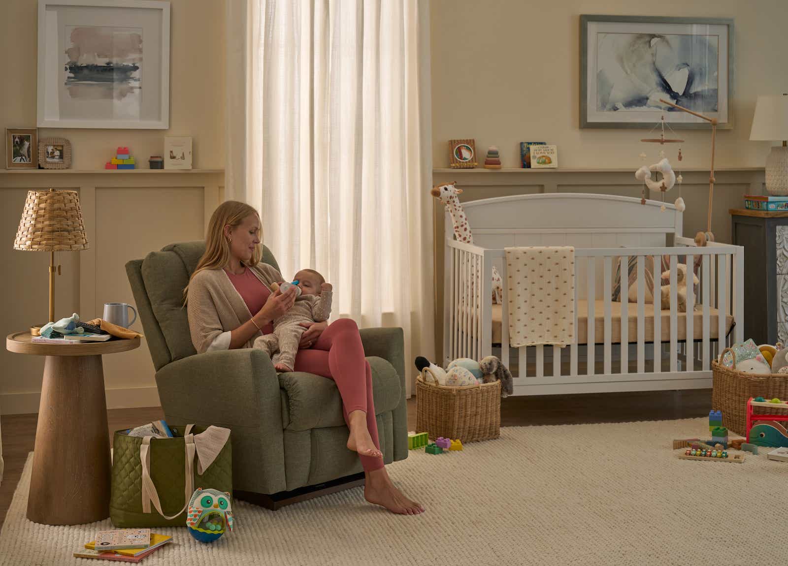 A woman and baby relaxing in a La-Z-Boy Recliner
