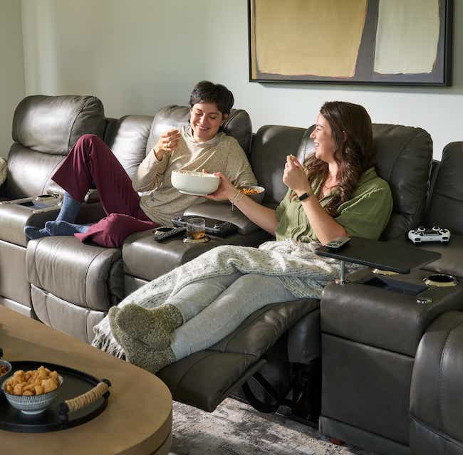 two friends relaxing on a sectional