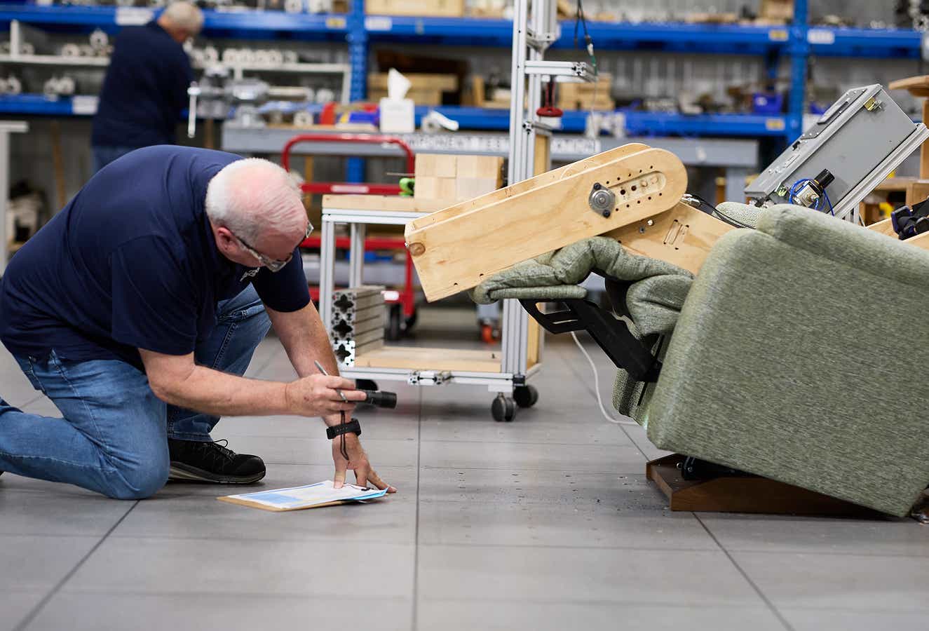 a man testing the build of a recliner
